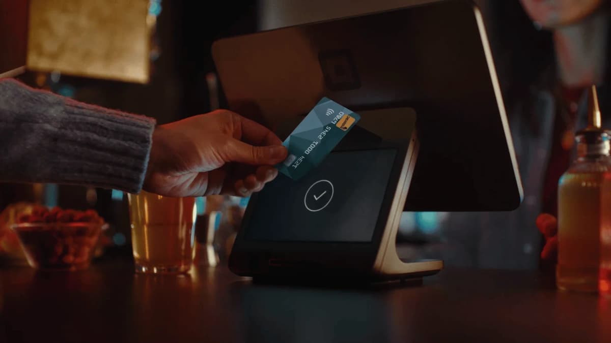 A laptop showing a Square Item Sales report next to a craft fair packing list