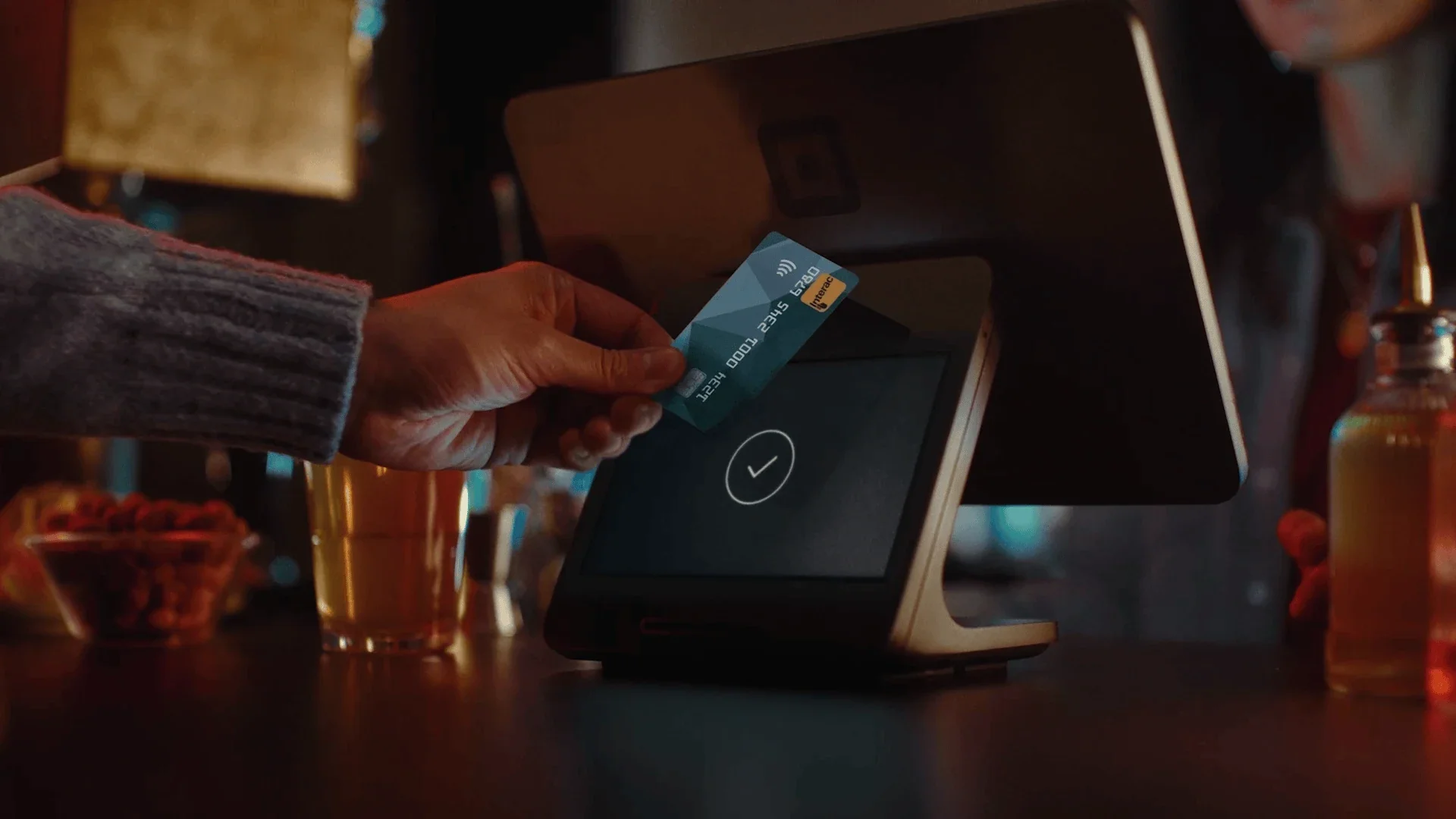 A laptop showing a Square Item Sales report next to a craft fair packing list